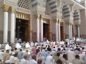 A congregation of people in prayer in Masjid Nabvi