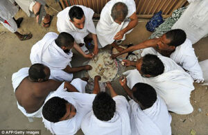 Pilgrims sharing a meal